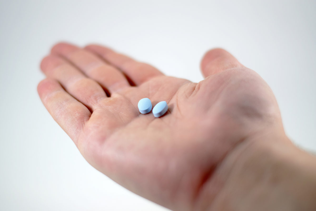 bigstock-Male-Hand-With-Blue-Pills-149790215-1200x800.jpg